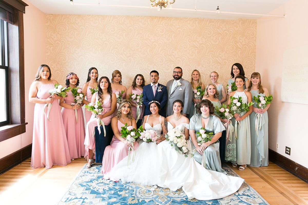 Brides with wedding party in private suite at The Haight