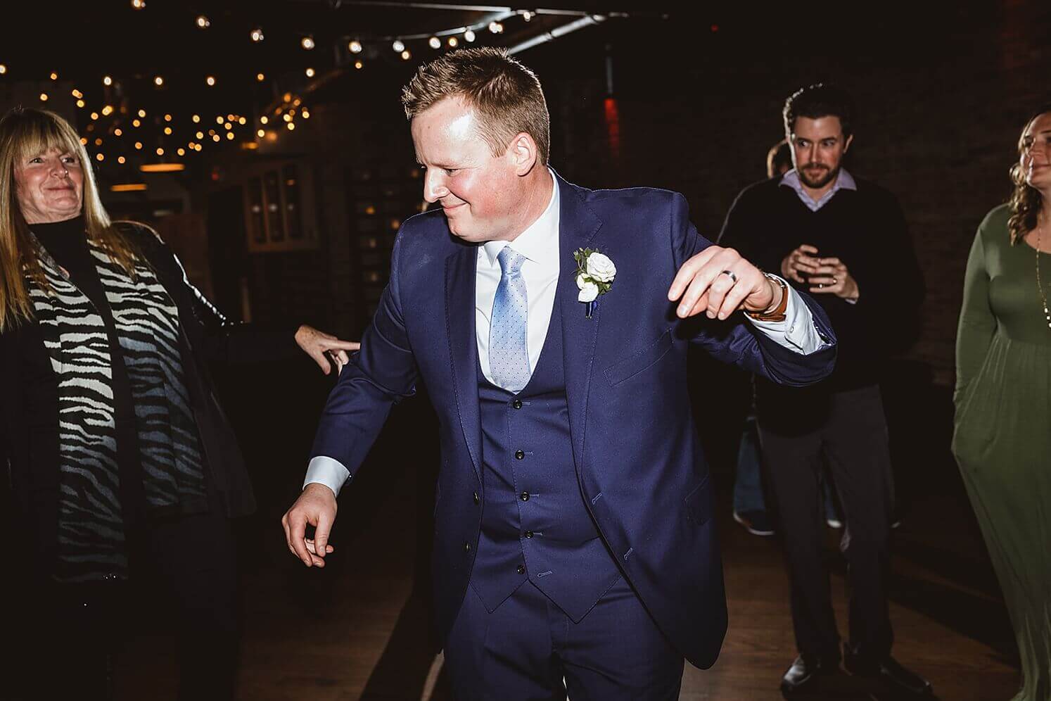 Groom dancing at wedding reception at The Haight