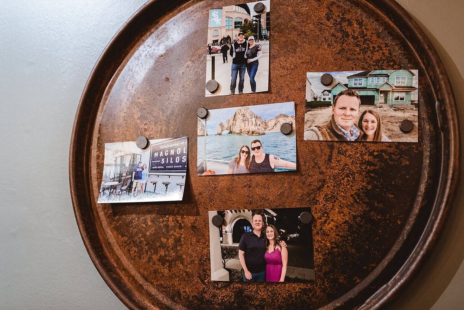 Couple's photos on round board at The Haight