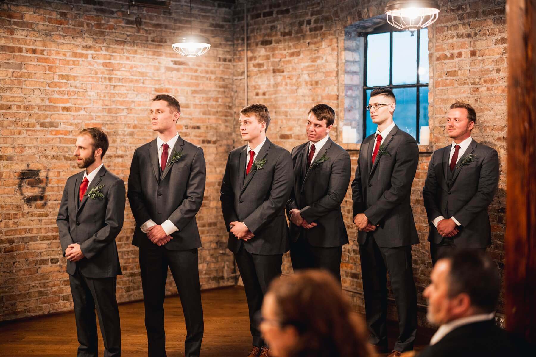 Groomsmen wearing gray suits at wedding venue in Illinois