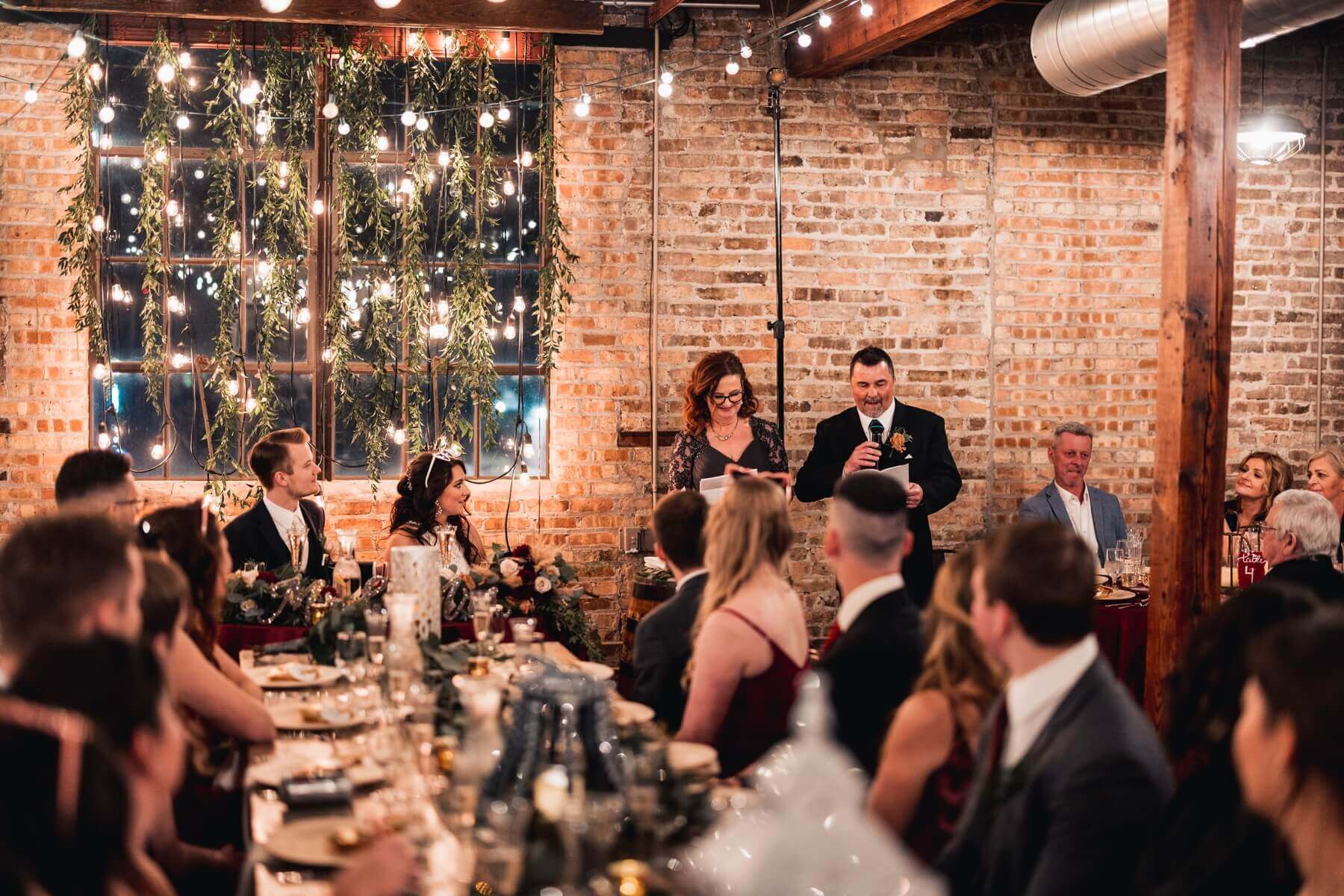 Bride's parents giving toast at wedding venue in Illinois
