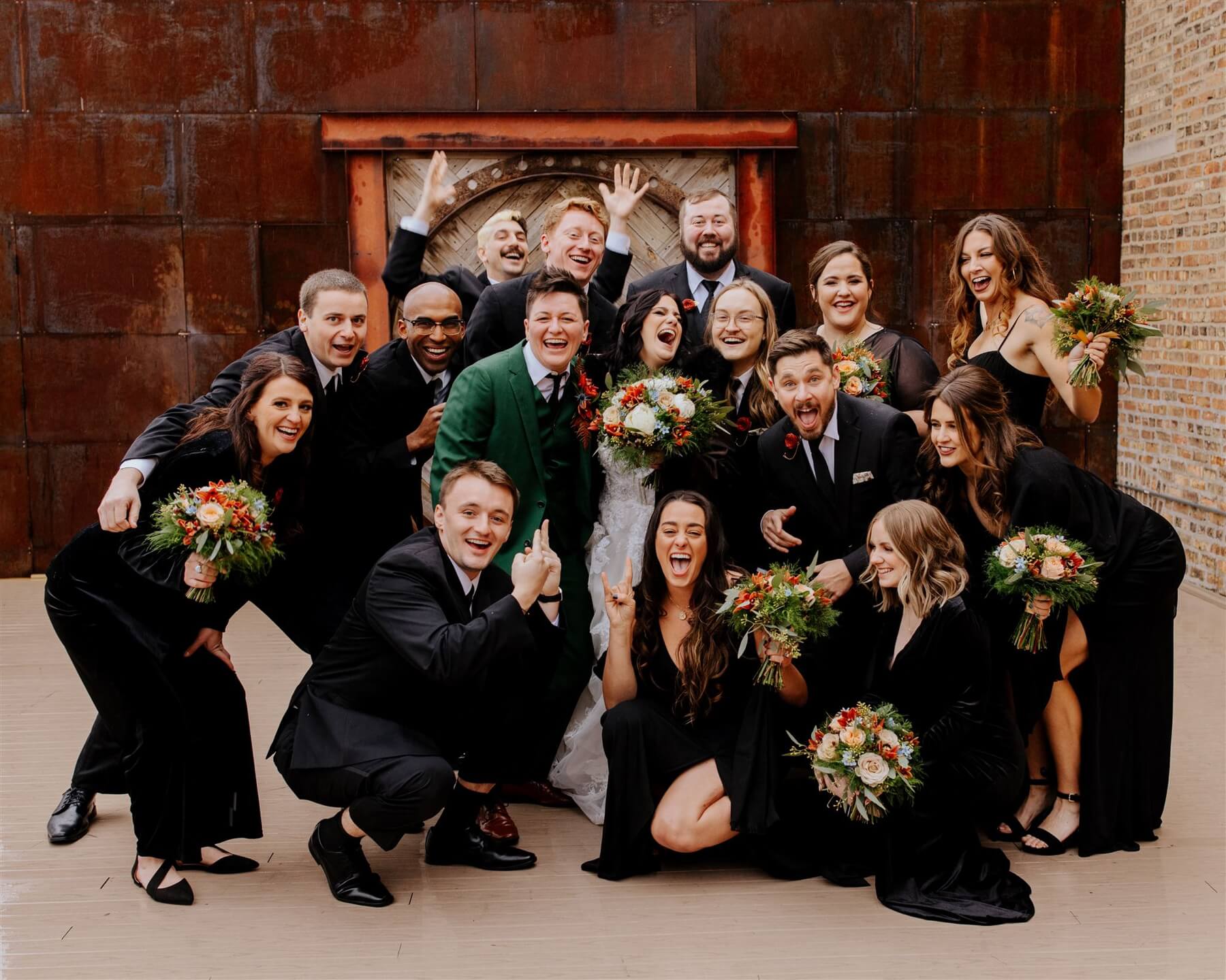 Couple in candid photo with wedding party