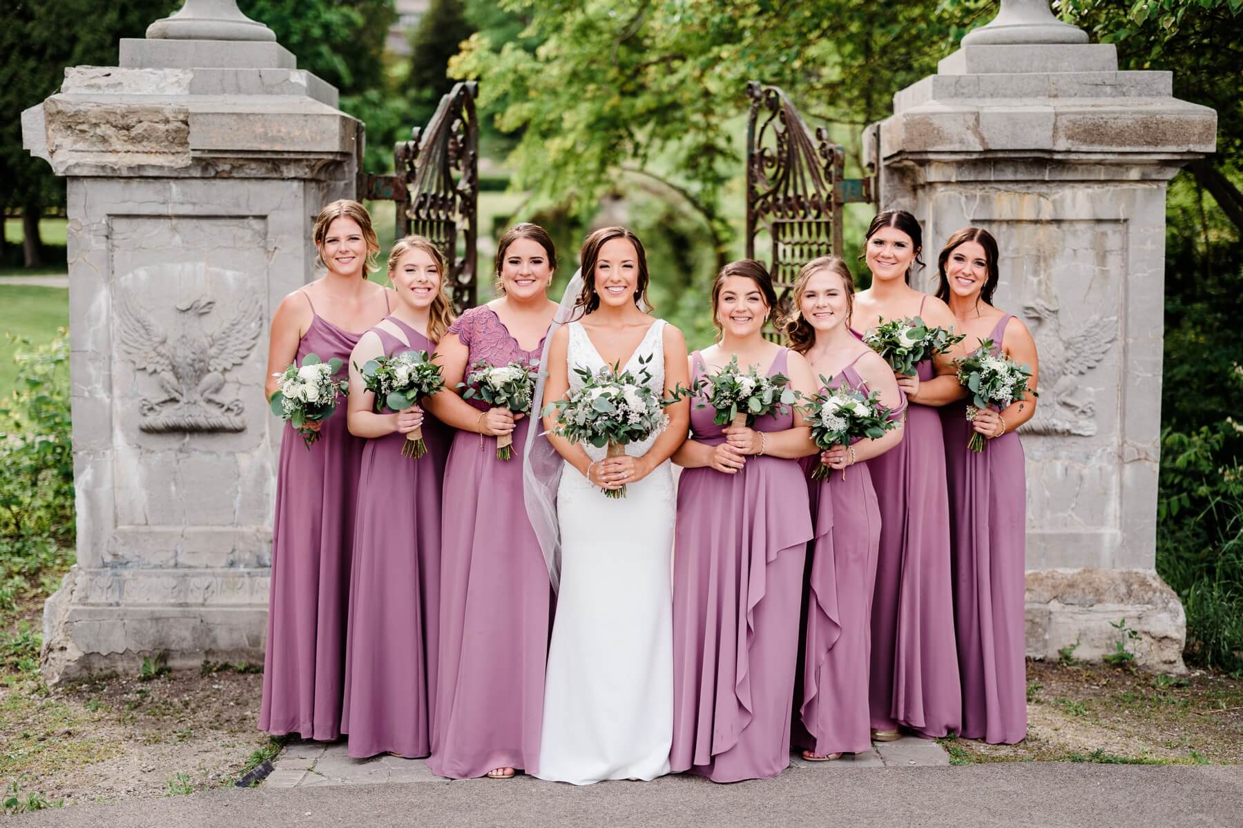 Bride with bridesmaids in purple dresses