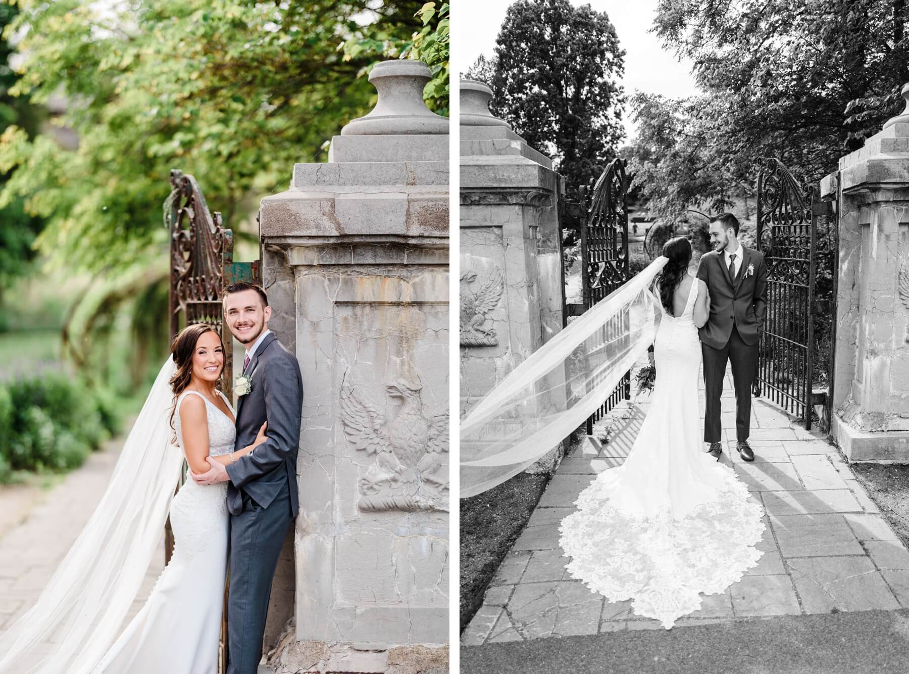 Bride and groom taking photos next to gray stone pillar in garden