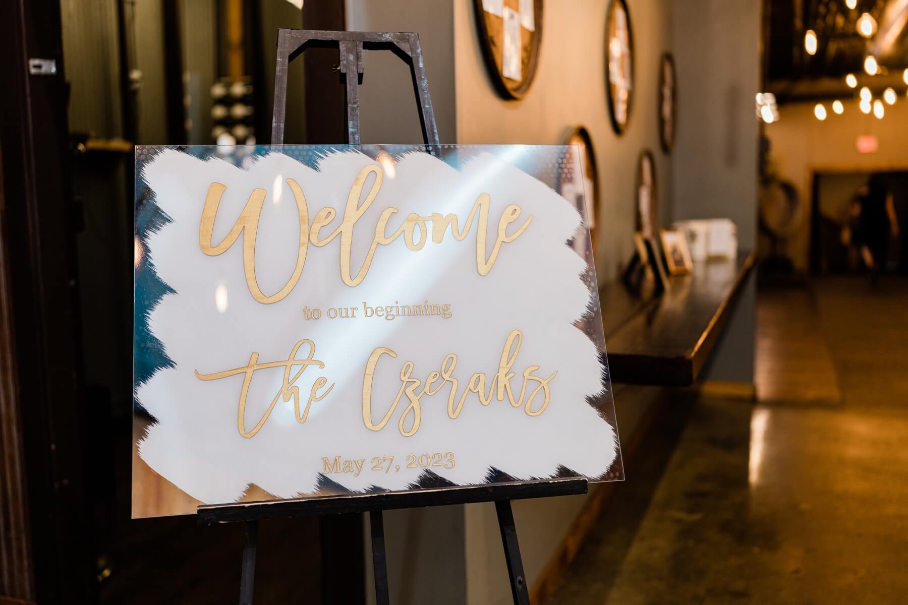 White acrylic wedding welcome sign at The Haight