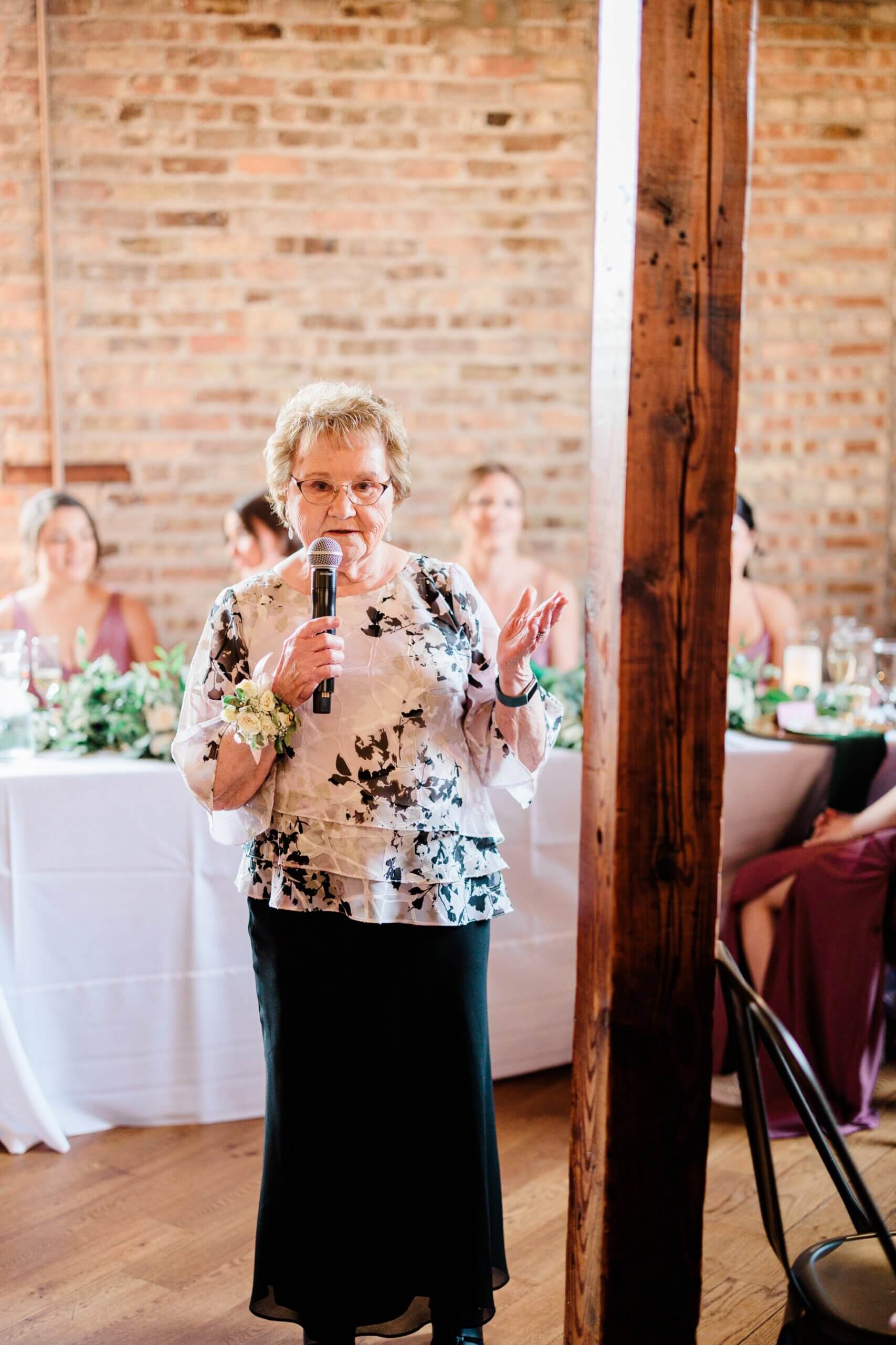 Bride's grandmother giving blessing at wedding reception