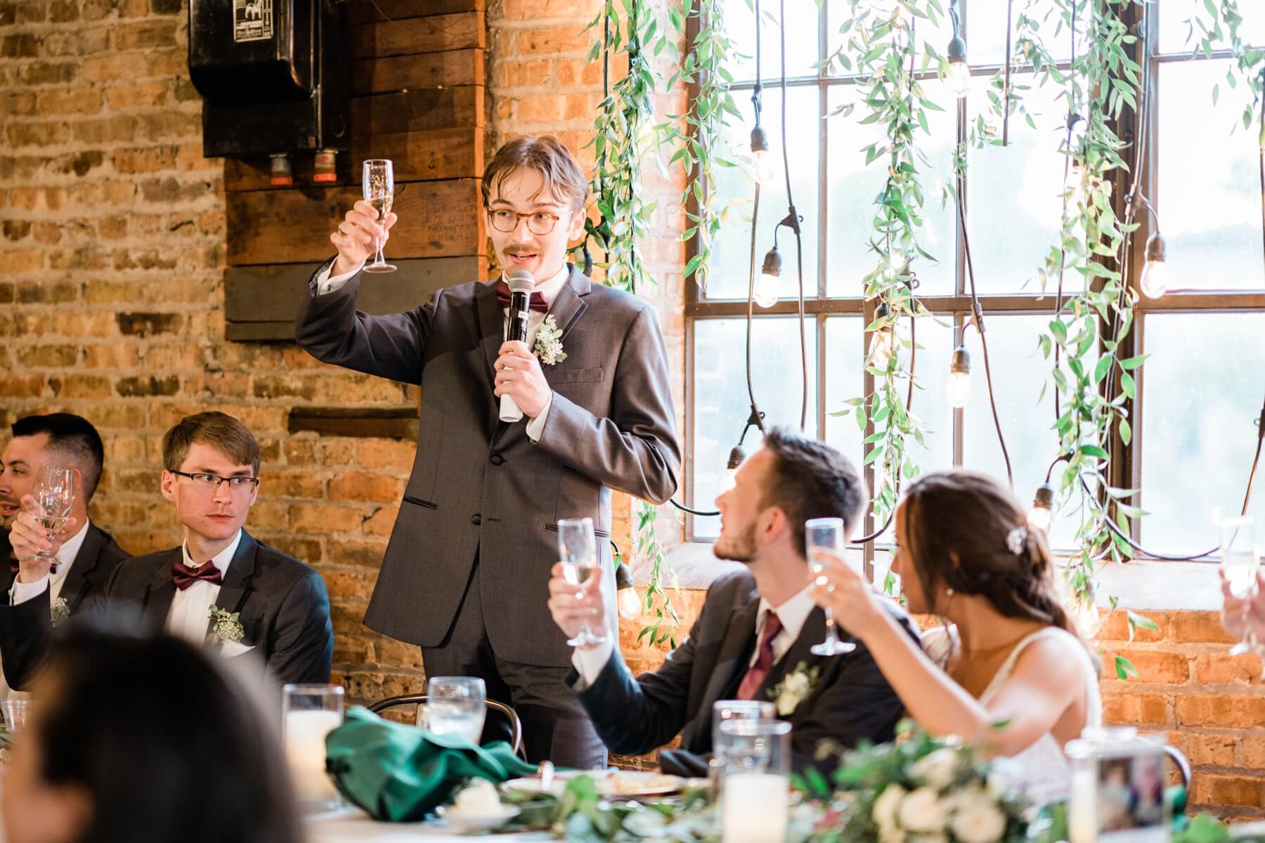 Best man giving speech at wedding reception
