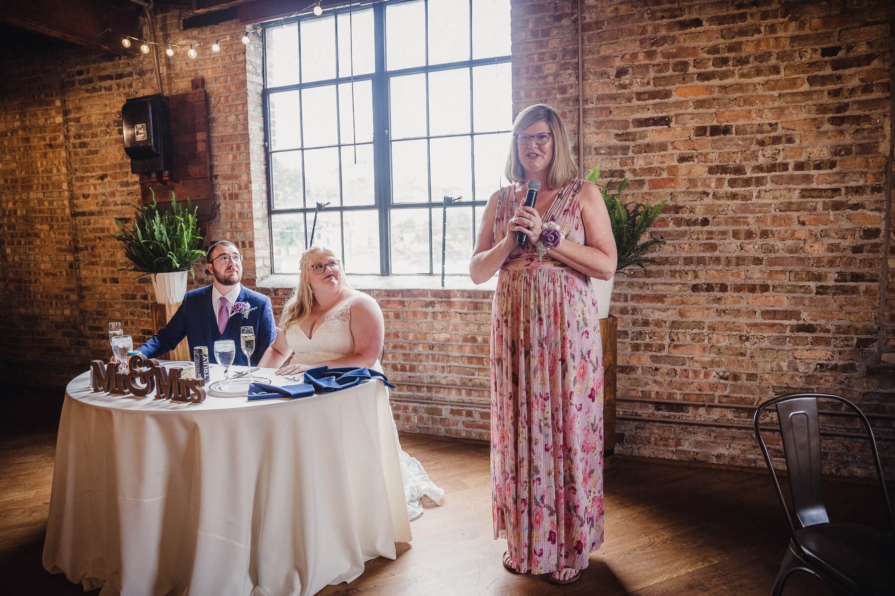 Mother of the bride giving a toast during wedding reception