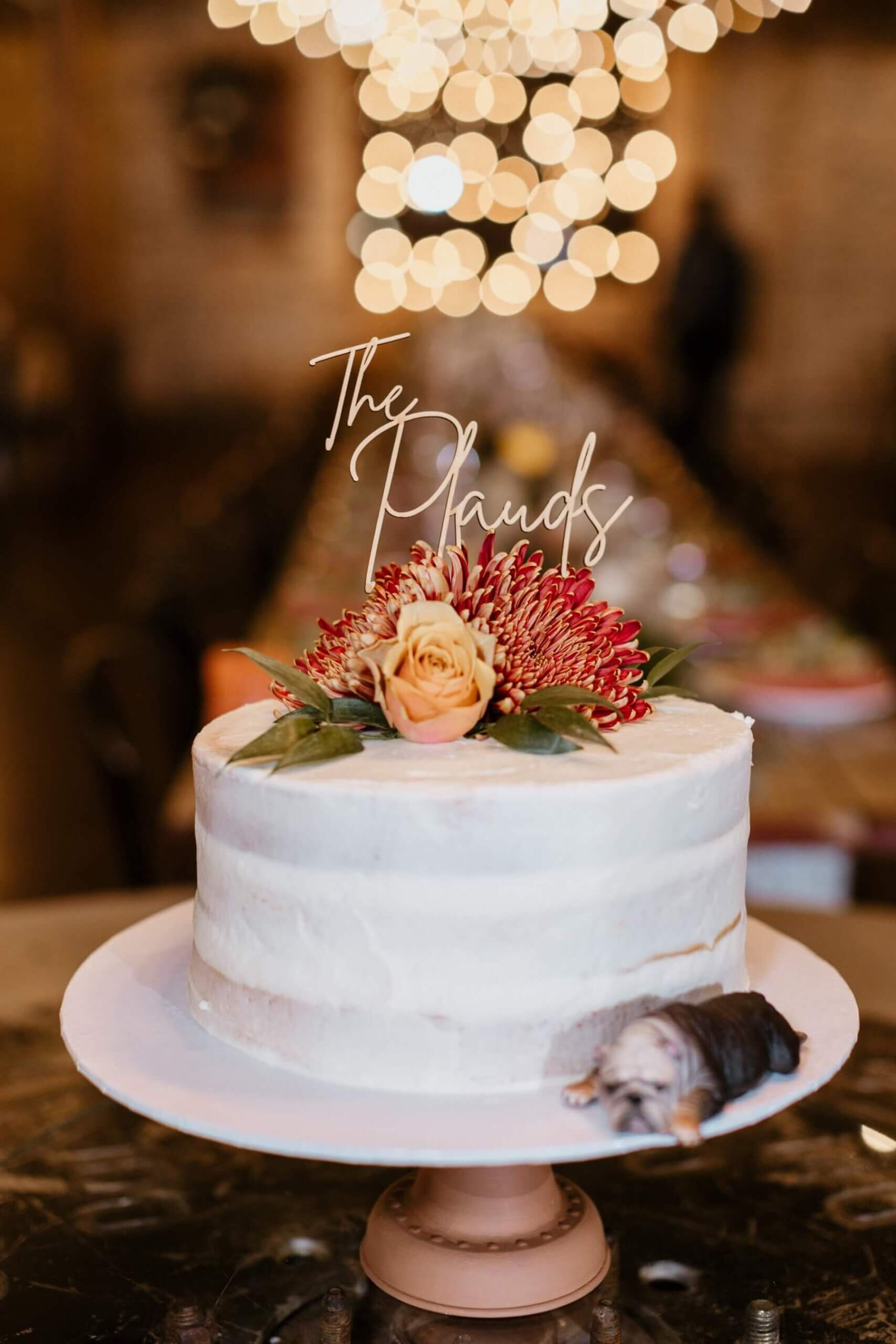 One tier wedding cake with boho flowers and cake topper